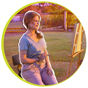 Deb painting a picture